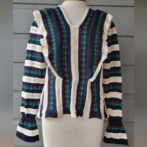 Vintage women's knitted ruffled black and cream sweater. Size Medium, no tags.